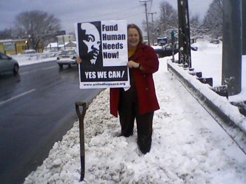 Carol Coakley at MLK breakfast stand out